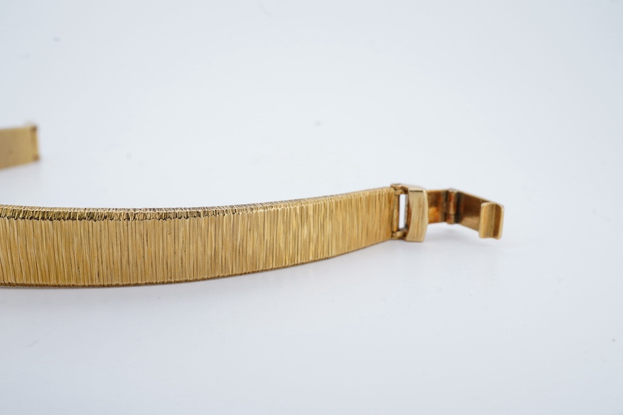 A lady's 1960's 18ct gold manual wind bracelet watch, overall length 16.5cm, gross weight 37.1 grams. Condition - fair to good